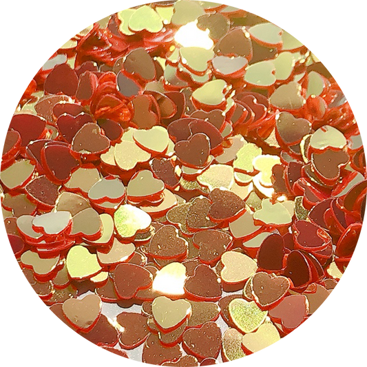 Paillettes cœurs rouges aux reflets dorés