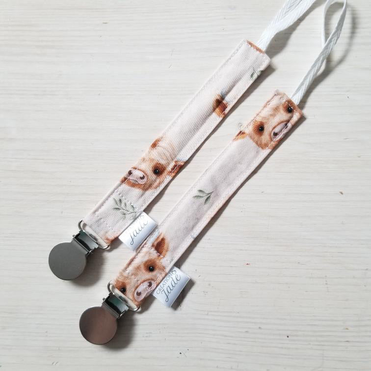 Nouveauté - Attache-suce Tissu - clip Inox - Vache Highland