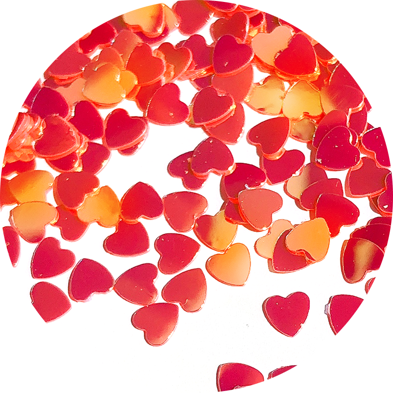 Paillettes cœurs rouges aux reflets dorés