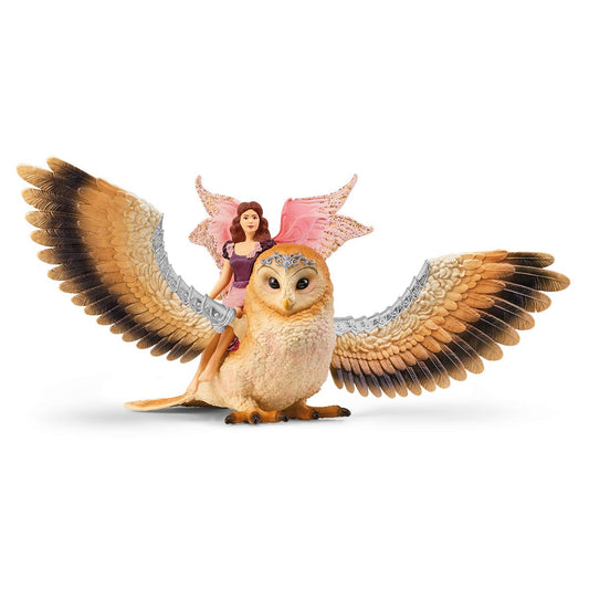 Fée en vol sur un hibou glamour